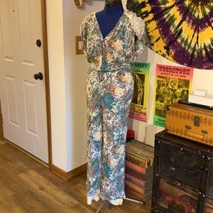 Anthropologie floral jumpsuit with lace size small